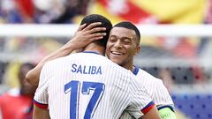 France's forward #10 Kylian Mbappe celebrates with France's defender #17 William Saliba after winning the UEFA Euro 2024 round of 16 football match between France and Belgium at the Duesseldorf Arena in Duesseldorf on July 1, 2024. (Photo by KENZO TRIBOUILLARD / AFP)