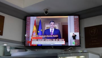 A TV broadcasting shows a statement by Spain's Prime Minister Pedro Sanchez in a bar, in Ronda, Spain, April 29, 2024. REUTERS/Jon Nazca