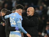Manchester City's Croatian defender #24 Josko Gvardiol speaks with Manchester City's Spanish manager Pep Guardiola after picking up an injury during the English Premier League football match between Manchester City and Chelsea at the Etihad Stadium in Manchester, north west England, on January 4, 2026. Manchester City have confirmed defender Josko Gvardiol suffered a broken leg in Sunday's 1-1 draw with Chelsea at the Etihad Stadium. (Photo by Oli SCARFF / AFP) / RESTRICTED TO EDITORIAL USE. No use with unauthorized audio, video, data, fixture lists, club/league logos or 'live' services. Online in-match use limited to 120 images. An additional 40 images may be used in extra time. No video emulation. Social media in-match use limited to 120 images. An additional 40 images may be used in extra time. No use in betting publications, games or single club/league/player publications. /