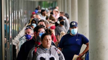 Hundreds of people line up outside a Kentucky Career Center hoping to find assistance with their unemployment claim in Frankfort, Kentucky.