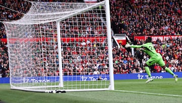 Lens' French forward Florian Sotoca scores past Manchester United's Cameroonian goalkeeper Andre Onana the first goal of his team during the pre-season friendly football match between Manchester United and Lens at Old Trafford stadium, in Manchester, on August 5, 2023. (Photo by Darren STAPLES / AFP)