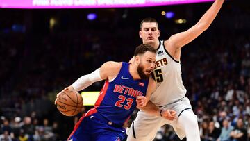 Mar 26, 2019; Denver, CO, USA; Detroit Pistons forward Blake Griffin (23) drives against Denver Nuggets center Nikola Jokic (15) in the second half at the Pepsi Center. Mandatory Credit: Ron Chenoy-USA TODAY Sports