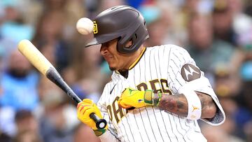 SAN DIEGO, CALIFORNIA - MAY 15: Manny Machado #13 of the San Diego Padres is hit by a pitch on the wrist during the second inning of a game against the Kansas City Royals at PETCO Park on May 15, 2023 in San Diego, California.   Sean M. Haffey/Getty Images/AFP (Photo by Sean M. Haffey / GETTY IMAGES NORTH AMERICA / Getty Images via AFP)