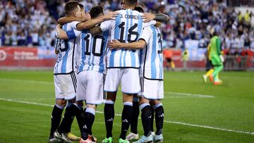 HARRISON, NEW JERSEY - SEPTEMBER 27: Lionel Messi #10 of Argentina is congratulated by teammates after he scored in the second half against Jamaica at Red Bull Arena on September 27, 2022 in Harrison, New Jersey. Argentina defeated Jamaica 3-0.   Elsa/Getty Images/AFP