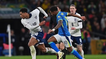 England's midfielder #10 Jude Bellingham (L) runs away from Brazil's midfielder #10 Rodrygo (C) during the international friendly football match between England and Brazil at Wembley stadium in north London on March 23, 2024. (Photo by Glyn KIRK / AFP) / NOT FOR MARKETING OR ADVERTISING USE / RESTRICTED TO EDITORIAL USE