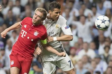 Real Madrid's Portuguese forward Cristiano Ronaldo (R) heads the ball to score beside Bayern Munich's defender Philipp Lahm during the UEFA Champions League quarter-final second leg.