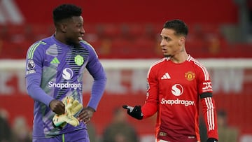 Manchester United's Cameroonian goalkeeper #24 Andre Onana (L) speaks with Manchester United's Swedish defender #02 Victor Lindelof at the end of the English Premier League football match between Manchester United and Brighton and Hove Albion at Old Trafford in Manchester, north west England, on January 19, 2025. Brighton and Hove Albion won 3 - 1 against Manchester United. (Photo by Ian HODGSON / AFP) / RESTRICTED TO EDITORIAL USE. No use with unauthorized audio, video, data, fixture lists, club/league logos or 'live' services. Online in-match use limited to 120 images. An additional 40 images may be used in extra time. No video emulation. Social media in-match use limited to 120 images. An additional 40 images may be used in extra time. No use in betting publications, games or single club/league/player publications. /