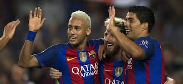 Neymar (left) alongside strike partners Leo Messi (centre) and Luis Suárez.