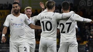 Manchester City's Kevin De Bruyne, 2nd left, celebrates after Raheem Sterling scored their side's fifth goal during the English Premier League soccer match between Wolverhampton Wanderers and Manchester City at Molineux stadium in Wolverhampton,
