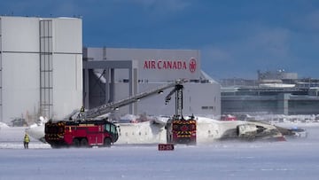 First responders work at the Delta Air Lines plane crash site at Toronto Pearson International Airport in Mississauga, Ontario, Canada February 17, 2025. REUTERS/Arlyn McAdorey