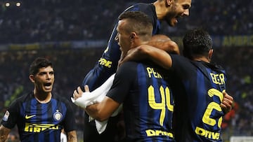 Inter Milan&#039;s Croatian forward Ivan Perisic (2nd L) celebrates with Inter Milan&#039;s Argentinian forward Mauro Emanuel Icardi (top) after scoring during the Italian Serie A football match Inter Milan Vs Juventus on September 18, 2016 at the San Sir