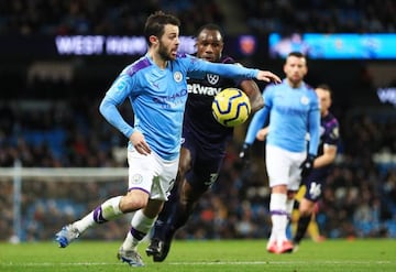 Bernardo Silva of Manchester City takes on Michail Antonio of West Ham during a Premier League match.