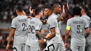 Paris Saint-Germain's Argentinian forward Lionel Messi (C) celebrates his goal with French forward Kylian Mbappe (C) during PSG's Japan Tour football match against Kawasaki Frontale at the National Stadium in Tokyo on July 20, 2022. (Photo by Kazuhiro NOGI / AFP)