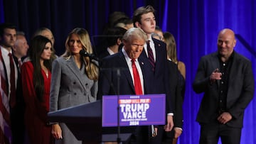 Republican presidential nominee and former U.S. President Donald Trump takes the stage accompanied by Melania Trump and his son Barron, following early results from the 2024 U.S. presidential election in Palm Beach County Convention Center, in West Palm Beach, Florida, U.S., November 6, 2024. REUTERS/Carlos Barria