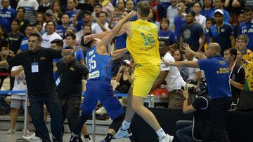 (FILES) This file photo taken on July 2, 2018 shows Mathew Wright (L) of the Philippines and Daniel Kickert of Australia exchanging blows in a brawl during their FIBA World Cup Asian qualifier game at the Philippine arena in Bocaue town, Bulacan province,