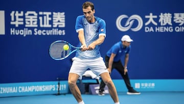 Albert Ramos-Vinolas of Spain hits a return against Gael Monfils of France during their men's singles quarter-final match at the Zhuhai Championships tennis tournament in Zhuhai in China's southern Guangdong province on September 27, 2019. (Photo by STR / AFP) / China OUT