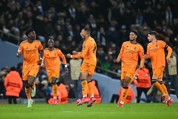 Real Madrid's French forward #09 Kylian Mbappe celebrates  after scoring his team first goal during the UEFA Champions League football match between Manchester City and Real Madrid at the Etihad Stadium in Manchester, north west England, on February 11, 2025. (Photo by Paul ELLIS / AFP)