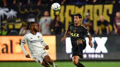 Oct 20, 2022; Los Angeles, California, US; Los Angeles FC forward Carlos Vela (10) battles against Los Angeles Galaxy forward Raheem Edwards (44) during the first half of the MLS Cup Playoff semifinal at Banc Of California Stadium. Mandatory Credit: Gary A. Vasquez-USA TODAY Sports