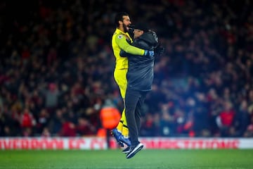 Jumping for joy: Klopp and Alisson