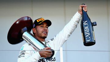 SUZUKA, JAPAN - OCTOBER 07:  Race winner Lewis Hamilton of Great Britain and Mercedes GP celebrates on the podium during the Formula One Grand Prix of Japan at Suzuka Circuit on October 7, 2018 in Suzuka.  (Photo by Mark Thompson/Getty Images)