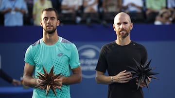 WINSTON SALEM, NORTH CAROLINA - AUGUST 27: Champion Adrian Mannarino (R) of France poses with finalist Laslo Djere of Serbia following the men's singles championship final on day eight of the Winston-Salem Open at Wake Forest Tennis Complex on August 27, 2022 in Winston Salem, North Carolina.   Jared C. Tilton/Getty Images/AFP
== FOR NEWSPAPERS, INTERNET, TELCOS & TELEVISION USE ONLY ==
