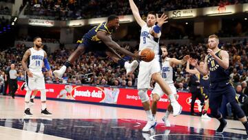 Nov 27, 2017; Indianapolis, IN, USA; Indiana Pacers guard Lance Stephenson (1) makes a pass to forward Domantas Sabonis (11) against Orlando Magic center Nikola Vucevic (9) during the 4th quarter at Bankers Life Fieldhouse. Mandatory Credit: Brian Spurlock-USA TODAY Sports TPX IMAGES OF THE DAY
