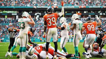 MIAMI, FL - OCTOBER 14: Eddie Jackson #39 reacts after Eddie Goldman #91 of the Chicago Bears recovered a fumble by Kenyan Drake #32 of the Miami Dolphins in overtime during the game at Hard Rock Stadium on October 14, 2018 in Miami, Florida.   Mark Brown