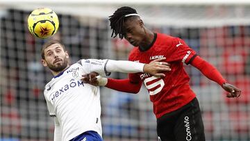 Soccer Football - Ligue 1 - Stade Rennes v Stade de Reims - Roazhon Park, Rennes, France - October 4, 2020 Stade Rennes' Eduardo Camavinga in action with Stade de Reims' Arber Zeneli REUTERS/Stephane Mahe