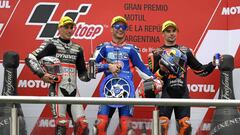 Italy&#039;s Kalex biker Mattia Pasini (C) Spain&#039;s Kalex biker Xavi Vierge (L) and Portugal&#039;s KTM biker Miguel Oliveira celebrate their first, second and third place respectively, at the podium of the Moto2 race of the Argentina Grand Prix at Te