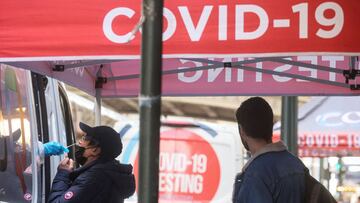 FILE PHOTO: A man is given a coronavirus disease (COVID-19) test at pop-up testing site in New York City, U.S., April 11, 2022. REUTERS/Brendan McDermid/File Photo