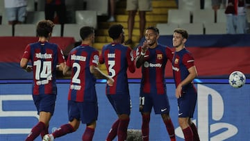 Barcelona's Brazilian forward #11 Raphinha celebrates with teammates after Antwerp's Belgian defender #34 Jelle Bataille scored an own goal during the UEFA Champions League 1st round day 1 Group H football match between FC Barcelona and Royal Antwerp FC at the Estadi Olimpic Lluis Companys in Barcelona on September 19, 2023. (Photo by LLUIS GENE / AFP)