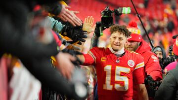 Jan 18, 2025; Kansas City, Missouri, USA; Kansas City Chiefs quarterback Patrick Mahomes (15) shakes hands with fans after defeating the Houston Texans in a 2025 AFC divisional round game at GEHA Field at Arrowhead Stadium. Mandatory Credit: Jay Biggerstaff-Imagn Images