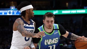 DALLAS, TEXAS - FEBRUARY 24: Luka Doncic #77 of the Dallas Mavericks dribbles the ball against D'Angelo Russell #0 of the Minnesota Timberwolves in the first half at American Airlines Center on February 24, 2020 in Dallas, Texas. NOTE TO USER: User expressly acknowledges and agrees that, by downloading and or using this photograph, User is consenting to the terms and conditions of the Getty Images License Agreement. Ronald Martinez/Getty Images/AFP
== FOR NEWSPAPERS, INTERNET, TELCOS & TELEVISION USE ONLY ==