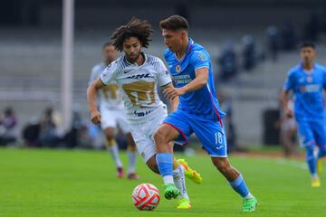 Rodrigo Huescas of Cruz Azul fights for the ball with Cesar Huerta of Pumas 