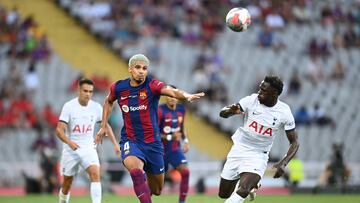 Barcelona's Uruguayan defender #04 Ronald Araujo vies with Tottenham Hotspur's Colombian defender #06 Davinson Sanchez during the 58th Joan Gamper Trophy football match between FC Barcelona and Tottenham Hotspur FC at the Estadi Olimpic Lluis Companys in Barcelona on August 8, 2023. (Photo by Pau BARRENA / AFP)