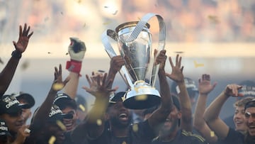 LOS ANGELES, CA - NOVEMBER 05: Kellyn Acosta #23 of LAFC lifts the trophy to celebrate after winning the MLS Cup Final match between Philadelphia Union and LAFC as part of the MLS Cup Final 2022 at Banc of California Stadium on November 5, 2022 in Los Angeles, California.