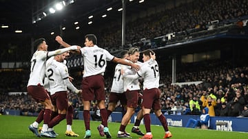 Manchester City's Argentinian striker #19 Julian Alvarez (R) celebrates with teammates after scoring his team second goal during the English Premier League football match between Everton and Manchester City at Goodison Park in Liverpool, north west England on December 27, 2023. (Photo by Paul ELLIS / AFP) / RESTRICTED TO EDITORIAL USE. No use with unauthorized audio, video, data, fixture lists, club/league logos or 'live' services. Online in-match use limited to 120 images. An additional 40 images may be used in extra time. No video emulation. Social media in-match use limited to 120 images. An additional 40 images may be used in extra time. No use in betting publications, games or single club/league/player publications. / 