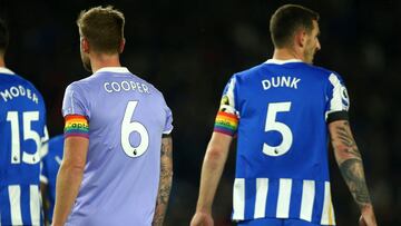 BRIGHTON, ENGLAND - NOVEMBER 27: Liam Cooper of Leeds United and Lewis Dunk of Brighton & Hove Albion wear rainbow captains armbands as clubs show their support to the Stonewall Rainbow Laces campaign during the Premier League match between Brighton &