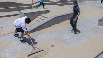 LOS ANGELES, CA - MAY 24: Skateboarders remove sand that was dumped into a skate park to keep them out during stay-at-home restrictions at Venice Beach on Memorial Day as coronavirus safety restrictions continue being relaxed in Los Angeles County and nat