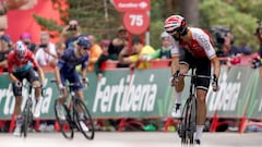 Team Cofidis' Spanish rider Jesus Herrada crosses first the finish line ahead of Team Groupama-Fdj's French rider Romain Gregoire and Team Lotto's Danish rider Andreas Lorentz Kron in the stage 11 of the 2023 La Vuelta cycling tour of Spain, a 163,5 km race from Lerma to Laguna Negra in Vinuesa, on September 6, 2023. (Photo by CESAR MANSO / AFP)