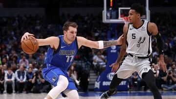 DALLAS, TEXAS - NOVEMBER 18: Luka Doncic #77 of the Dallas Mavericks dribbles the ball against Dejounte Murray #5 of the San Antonio Spurs in the first half at American Airlines Center on November 18, 2019 in Dallas, Texas. NOTE TO USER: User expressly acknowledges and agrees that, by downloading and or using this photograph, User is consenting to the terms and conditions of the Getty Images License Agreement. Ronald Martinez/Getty Images/AFP
== FOR NEWSPAPERS, INTERNET, TELCOS & TELEVISION USE ONLY ==