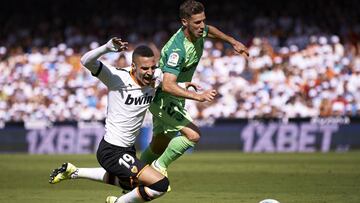 VALENCIA, SPAIN - SEPTEMBER 22: Rodrigo Moreno of Valencia is tackled by Ruben Perez of Leganes during the La Liga match between Valencia CF and CD Leganes at Estadio Mestalla on September 22, 2019 in Valencia, Spain. (Photo by Quality Sport Images/Getty