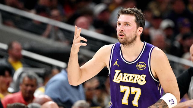 Mar 25, 2026; Indianapolis, Indiana, USA; Los Angeles Lakers guard Luka Doncic (77) celebrates a three point shot during the second quarter against the Indiana Pacers at Gainbridge Fieldhouse. Mandatory Credit: Marc Lebryk-Imagn Images