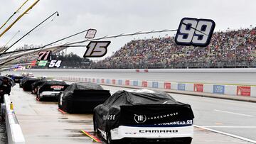 BROOKLYN, MICHIGAN - AUGUST 18: A general view of cars parked and covered during a weather delay prior to the NASCAR Cup Series FireKeepers Casino 400 at Michigan International Speedway on August 18, 2024 in Brooklyn, Michigan. Logan Riely/Getty Images/AFP (Photo by Logan Riely / GETTY IMAGES NORTH AMERICA / Getty Images via AFP)