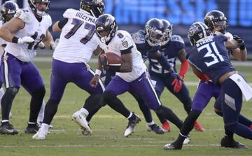 NASHVILLE, TENNESSEE - JANUARY 10: Lamar Jackson #8 of the Baltimore Ravens runs with the ball against the Tennessee Titans in the Wild Card Round of the NFL Playoffs at Nissan Stadium on January 10, 2021 in Nashville, Tennessee. Andy Lyons/Getty Images/A