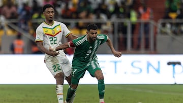 Senegal's #22 Abdou Diallo fights for the ball with Algeria's #7 Riyad Mahrez during the friendly international football match between Senegal and Algeria at the Abdoulaye Wade Stadium in Diamniadio on September 12, 2023. (Photo by JOHN WESSELS / AFP)