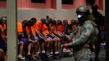 FILE PHOTO: Inmates in cell block 3 bow their head as they listen to a soldier at the militarized Litoral prison,as part of the measures taken by Ecuador's President Daniel Noboa to crackdown on gangs, during a media tour in Guayaquil, Ecuador, February 9, 2024. REUTERS/Santiago Arcos/File Photo