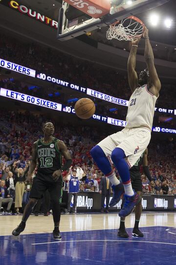 PHILADELPHIA, PA - MAY 7: Joel Embiid #21 of the Philadelphia 76ers dunks the ball past Terry Rozier #12 of the Boston Celtics in the third quarter during Game Four of the Eastern Conference Second Round of the 2018 NBA Playoffs at Wells Fargo Center on M