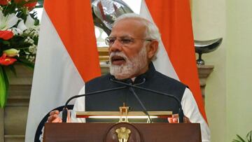 India&#039;s Prime Minister Narendra Modi speaks next to Japan&#039;s Prime Minister Fumio Kishida (not pictured) during press statement after the signing of an agreement in New Delhi on March 19, 2022. - Kishida arrived in India on March 19 with official