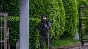 A soldier stands guard at the main entrance of Songshan Airport, ahead of the arrival of US House Speaker Nancy Pelosi, in Taipei, Taiwan, on Tuesday, Aug. 2, 2022. US House Speaker Nancy Pelosi is expected to land in Taiwan on Tuesday evening in defiance of Chinese threats, a trip that would make her the highest-ranking American politician to visit the island in 25 years. Photographer: Lam Yik Fei/Bloomberg via Getty Images